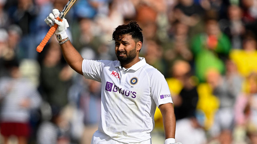 Raising his bat after yet another hundred