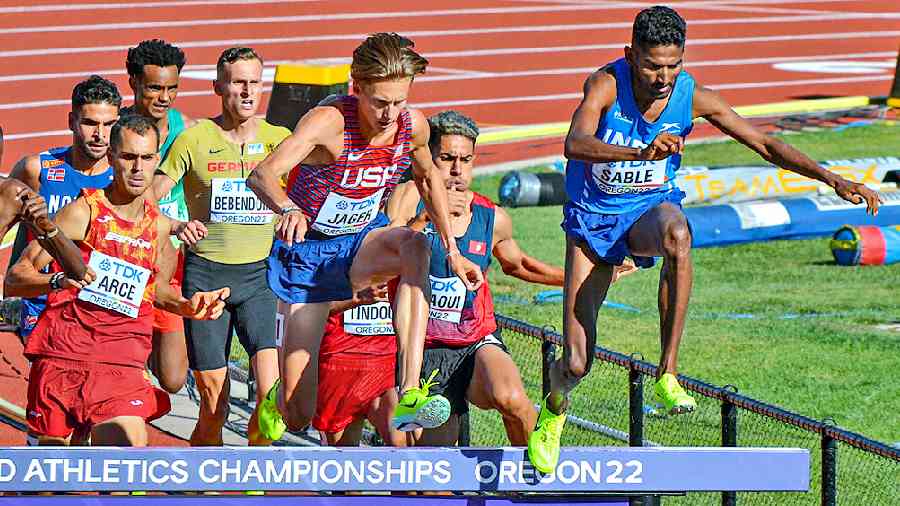 Avinash Sable (extreme right) during his heats in Eugene on Saturday. 