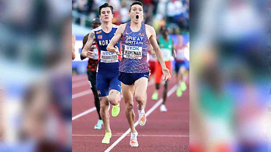 Britain’s Jake Wightman celebrates as he crosses the line to win the men’s 1500m final during the World Athletics Championships in Eugene on Tuesday.