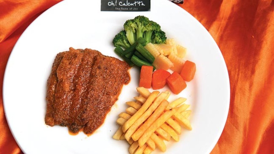 Smoked Hilsa (Boneless): Combining two cultural influences in a magical way, this Smoked Hilsa breaks away from the usual way of preparing hilsa by smoking the fish flesh instead, paired with a secret sauce that is simply to die for. For a complete meal, the fish is paired with fries cooked to perfection, along with tasteful steamed vegetables. Rs 1,145-plus