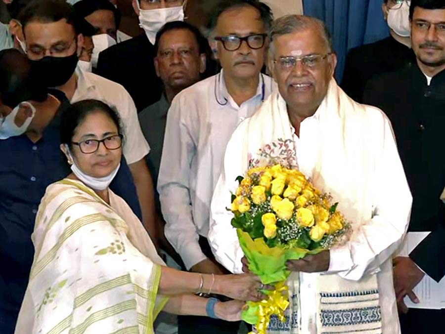 West Bengal CM Mamata Banerjee congratulates Manipur Governor La Ganesan after he takes oath as acting Governor of West Bengal, at Raj Bhawan in Kolkata on Monday