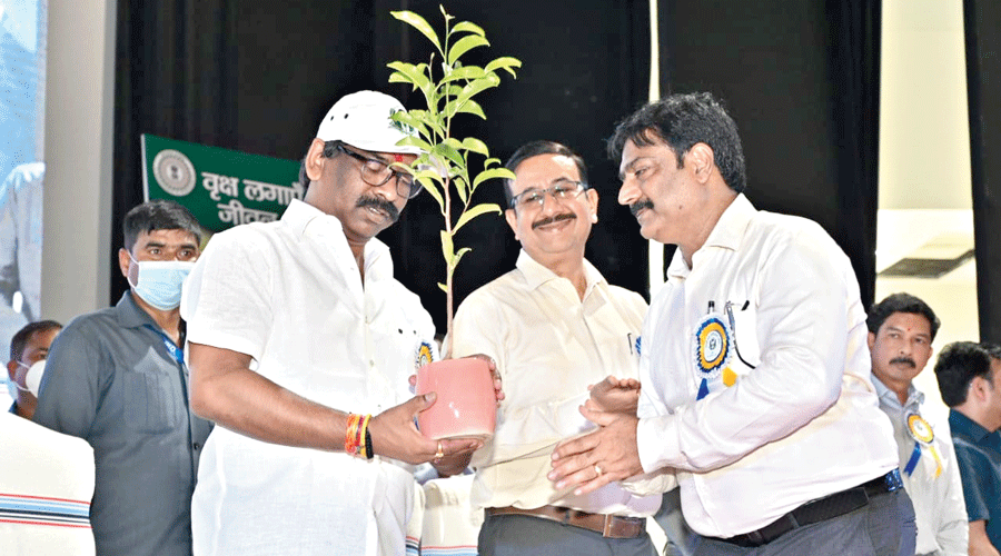 Hemant Soren receives a sapling at the Van Mahotsav event in Ranchi on Friday.