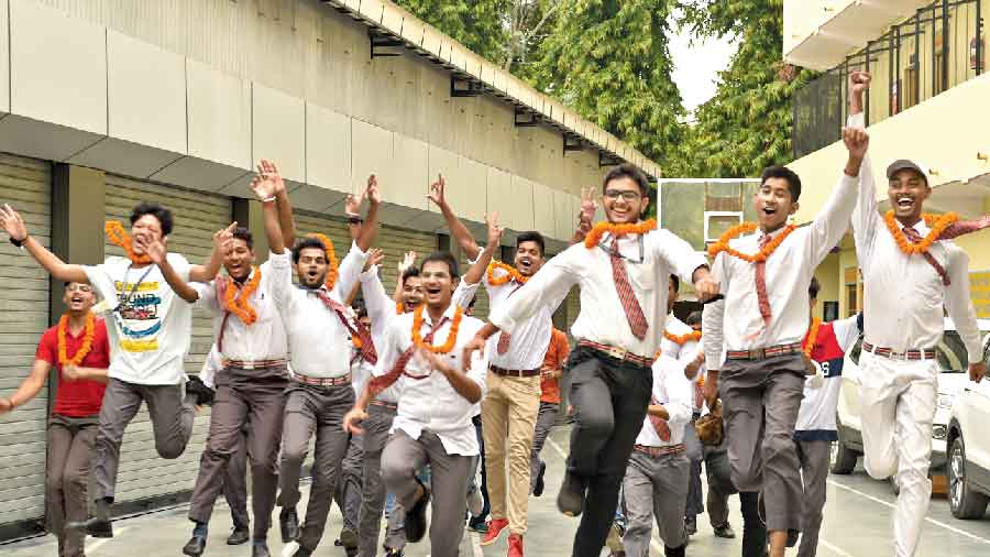 Students at a school in Lucknow celebrate after the ISC results were declared on Sunday