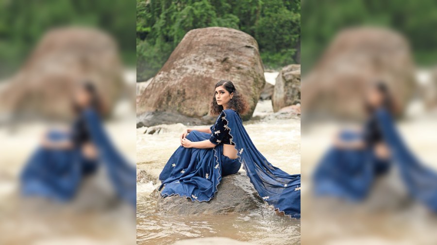 This occasionwear hand-embroidered sari features the edgy dragonfly motif. The blouse is made of velvet and the sari in tussore is coloured with blue dye.