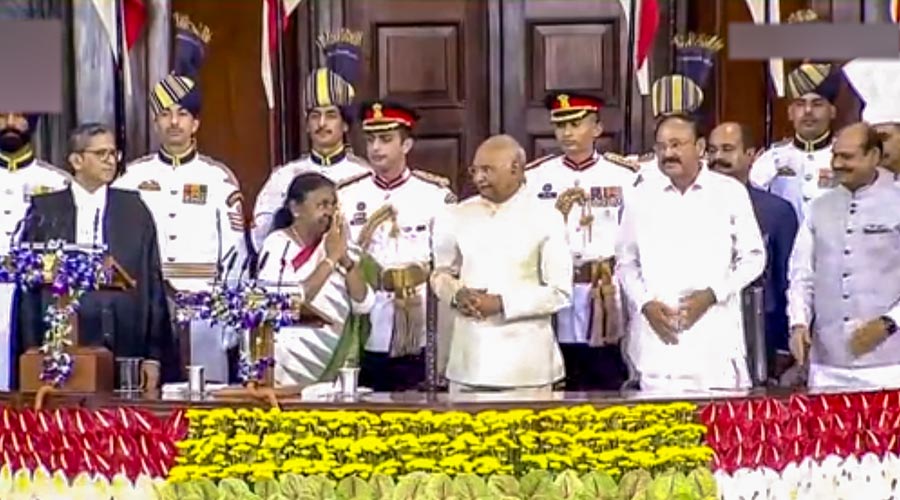 President-elect Droupadi Murmu with outgoing President Ram Nath Kovind, Vice President M Venkaiah Naidu, Chief Justice of India Justice NV Ramana and Lok Sabha Speaker Om Birla during her oath ceremony in the Central Hall of Parliament, in New Delhi, Monday, July 25, 2022.