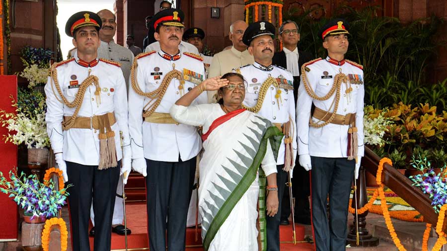 President Droupadi Murmu takes salute as she leaves after her oath ceremony in the Central Hall of Parliament, in New Delhi, Monday, July 25, 2022.