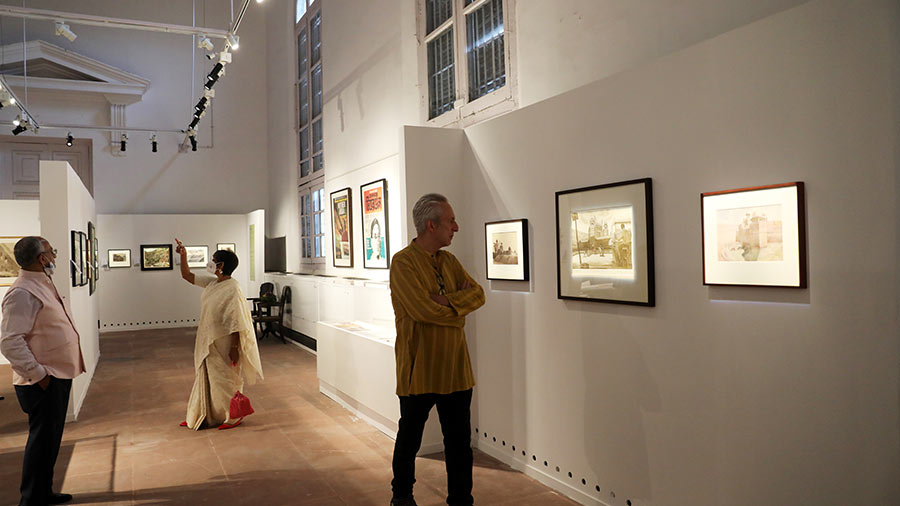 Visitors look at artworks at the exhibition presented by the Indian Museum in partnership with the Delhi Art Gallery.