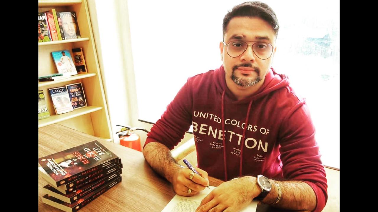 Novoneel Chakraborty signing his books for his readers 