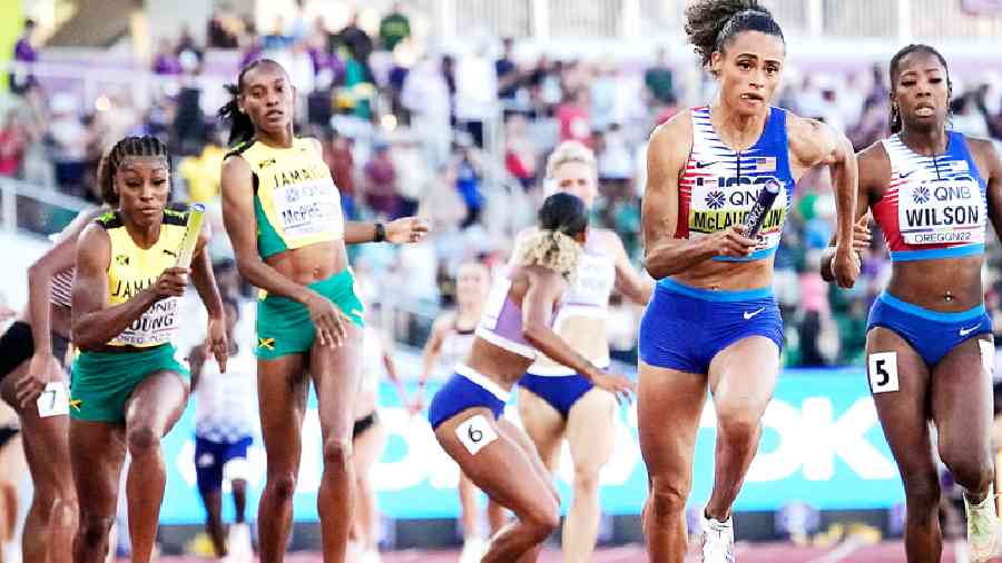 Sydney Mclaughlin of the US (second from right) takes the baton during the women’s 4x400m relay final at the World Athletics Championships on Sunday. 