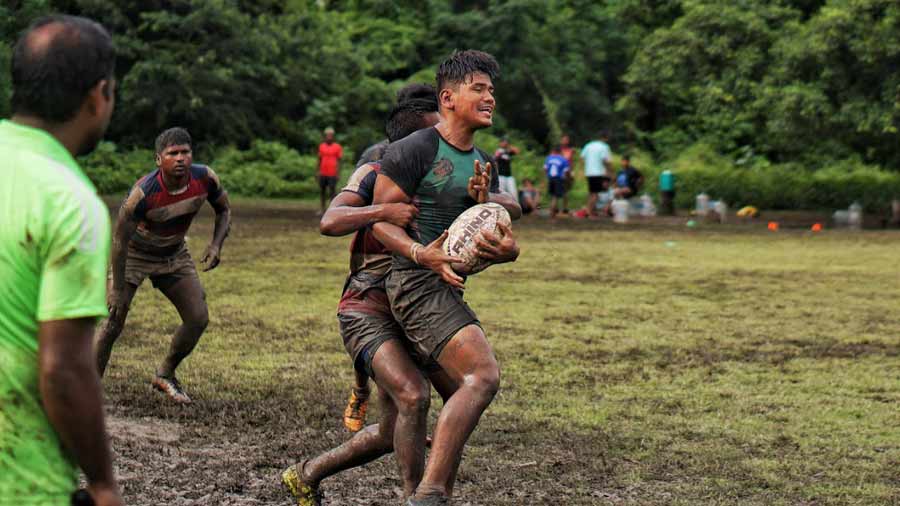 The players gave it their all, running at breakneck speed on the muddy pitch