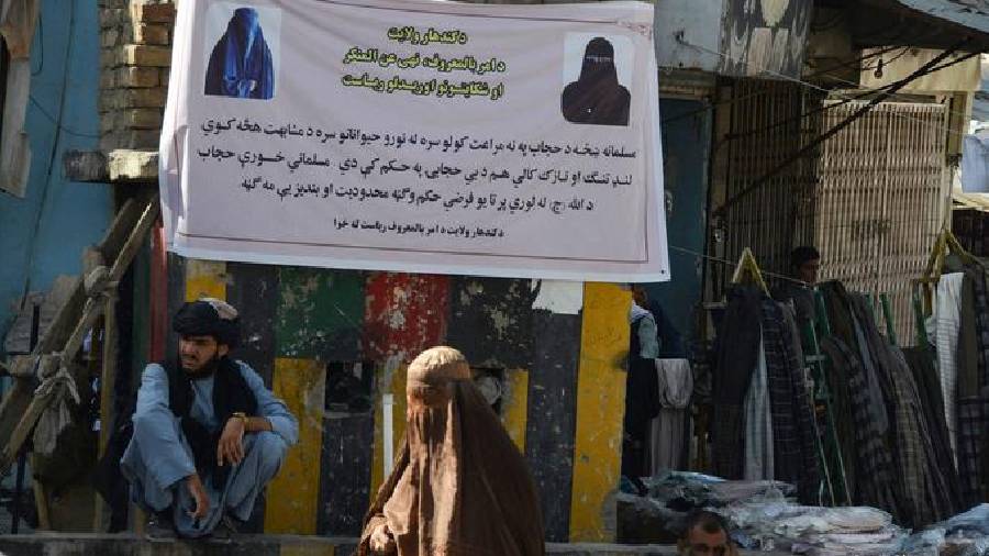 Taliban have put up banners asking women to cover their heads