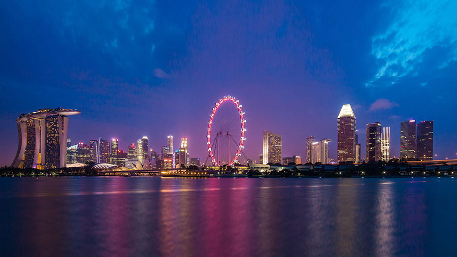 A night-time view of the waterfront Marina Bay in Singapore