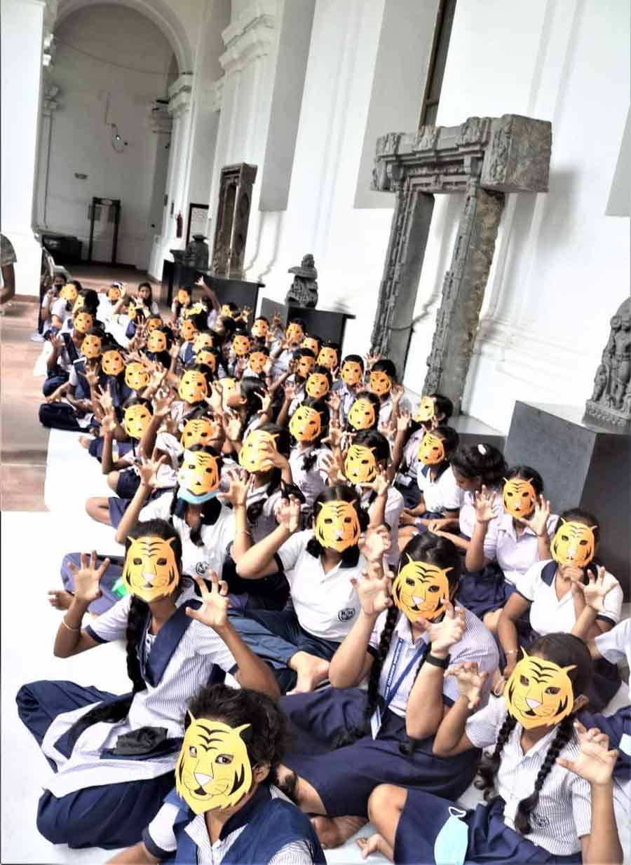 Schoolchildren celebrate World Tiger Day on Friday, July 29, at the Indian Museum. 