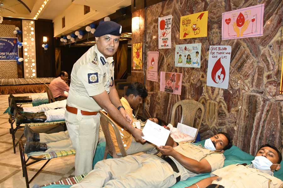 Policemen donate blood at a blood donation camp organised by Kolkata Police on Saturday, July 30.