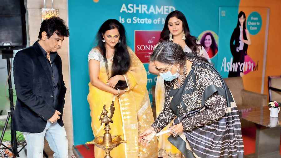 Usha Uthup lit the lamp at the Calcutta launch of first-time author Dahlia Sen Oberoi’s book Ashramed: From Chaos to Calm