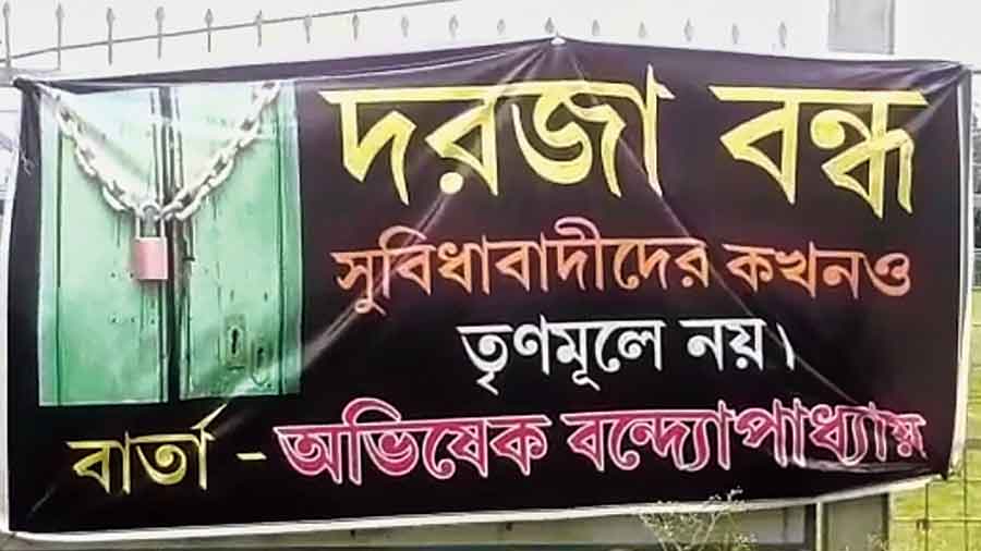 Posters with Abhishek Banerjee’s remark on turncoats at Jagaddal in North 24-Parganas on Tuesday. 