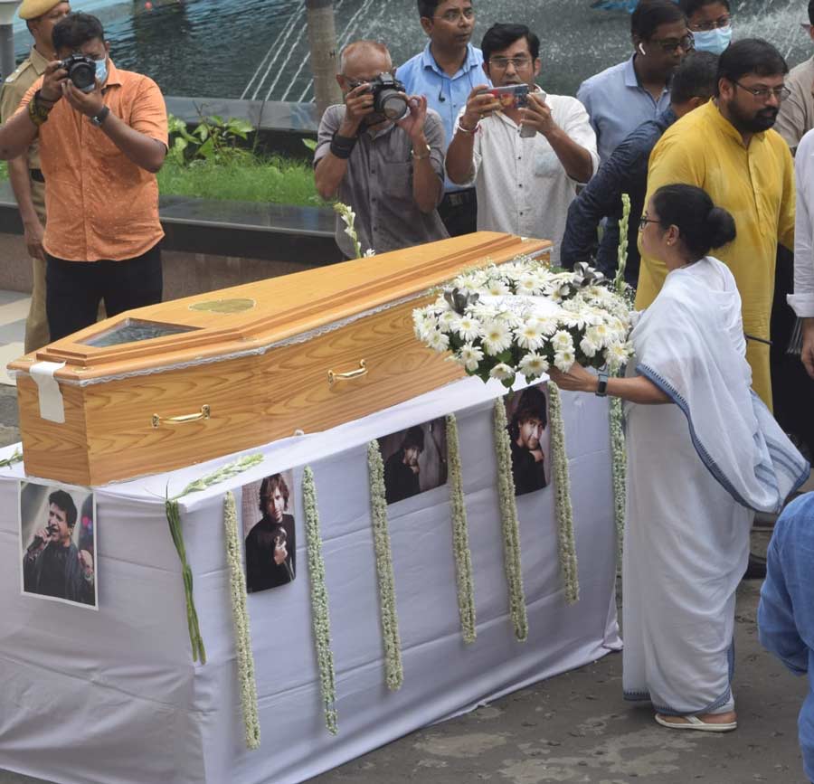 West Bengal chief minister Mamata Banerjee places a wreath on the coffin carrying KK’s mortal remains on Wednesday