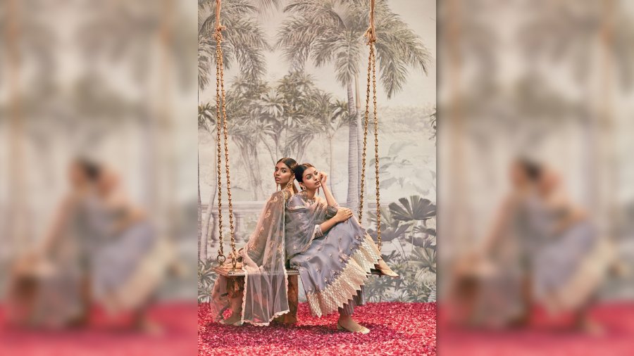 This silk-based outfit has delicate butas and zardosi embroidery with a beautiful gota palazzo and organza dupatta with a sleek border. “We have used muslin and embellished it with sequins and embroidery, paired with a brocade palazzo and a dupatta with scalloped edging,” explained Rashi.
