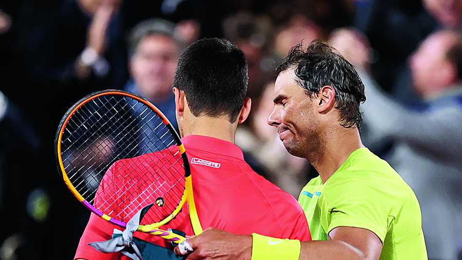 Novak Djokovic (left) and Rafael Nadal share a moment after the Spaniard’s victory on Tuesday.