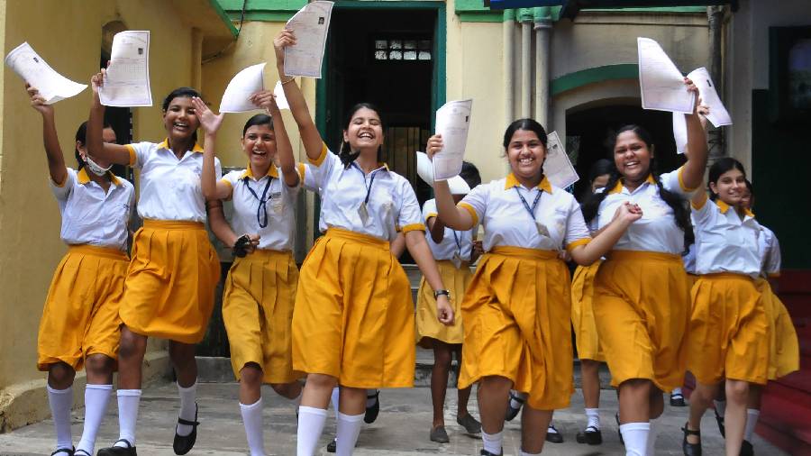 Students celebrate after WBBSE (West Bengal Board of Secondary Education) class 10th examination results were declared, at a school in Calcutta