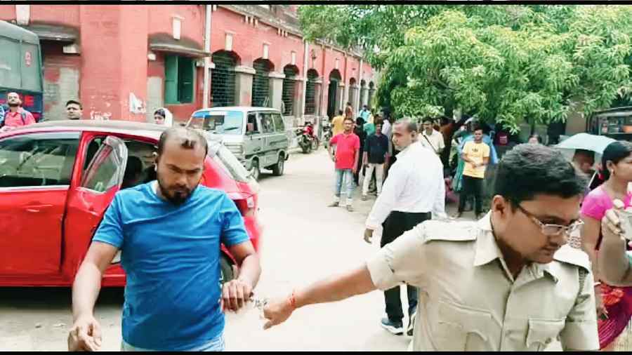 Iqbal Ahmed being brought to the court in Basirhat  on Friday.