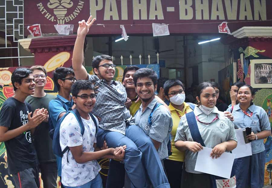 WITH FLYING COLOURS: Friends of Srutarshi Tripathi, a student of Patha Bhavan, give him a hurrah as he stood fourth in the Madhyamik examination on Friday, June 3. He is the only rank holder from Kolkata. 