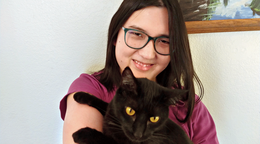 Sophie Zhang with her cat Shadow.