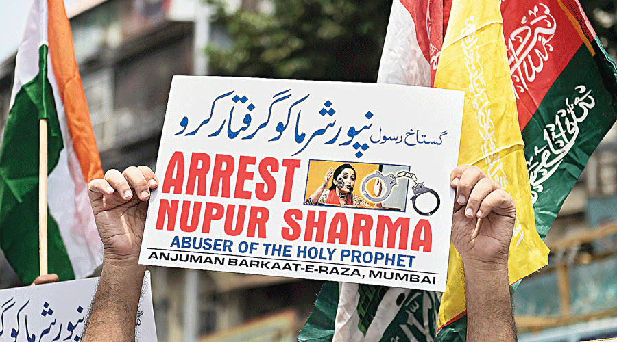 Activists demand the arrest of Nupur Sharma at a protest in Mumbai  on Monday.