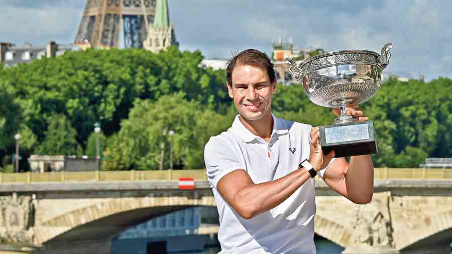 Rafael Nadal poses with the Musketeers’ Cup on Monday, a day after winning his  14th French Open title at Roland Garros.