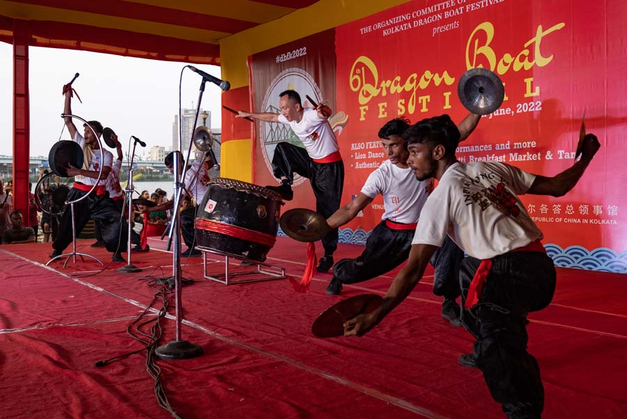 Participants performing at a drumming exhibition.