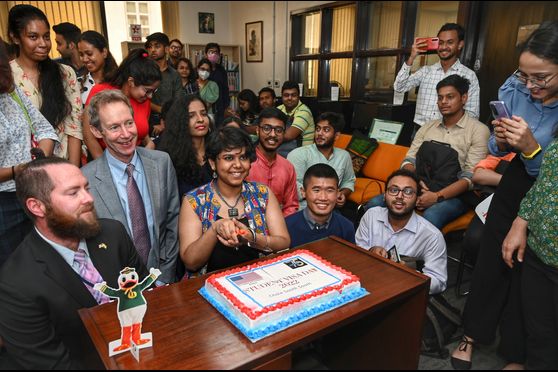 A cake-cutting ceremony was held to celebrate the students' journey to the US