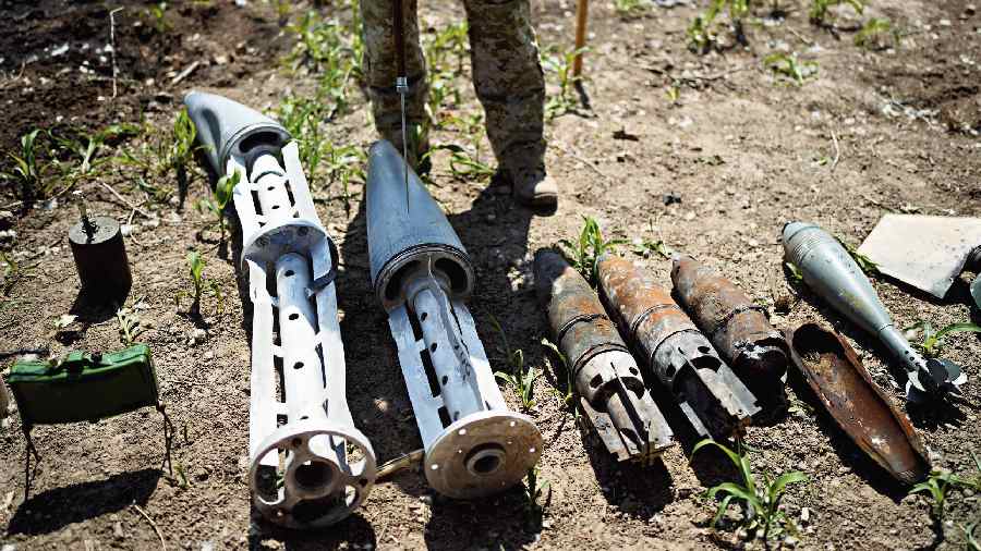 Unexploded shells and other weapons on display near Kyiv on Thursday. 