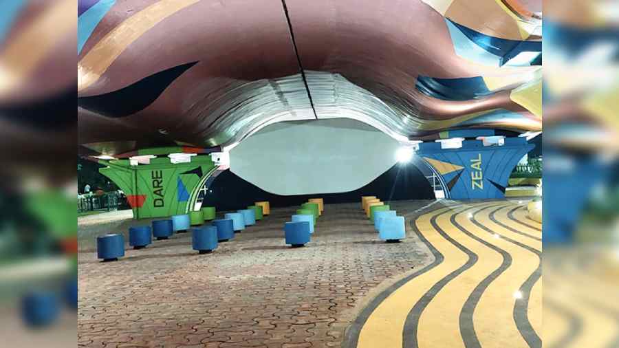 A sitting area with stools created under the flyover. 