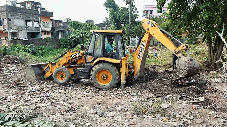 The pond being dug in Behala on Wednesday.