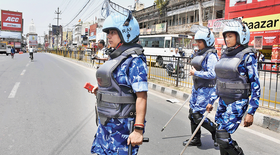 Rapid Action Force personnel patrol the streets in Ranchi on Sunday.
