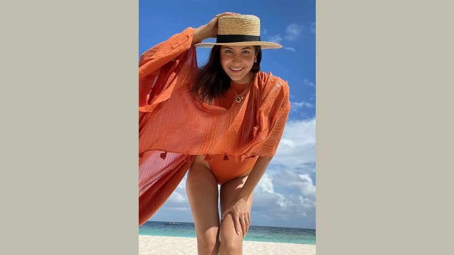 It’s vacay time for Anushka Sharma who shared her basking-in-sun picture in a bright orange beachwear, giving everyone major vacay and beach fashion goals.