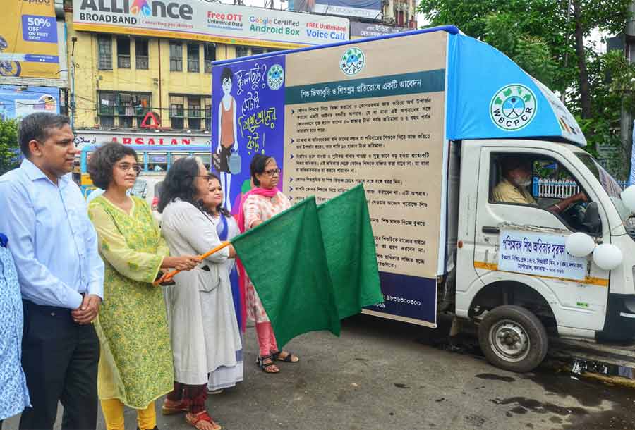 A tableau is being flagged off to campaign against child labour on World Day Against Child Labour at the Park Circus seven-point crossing on Sunday.