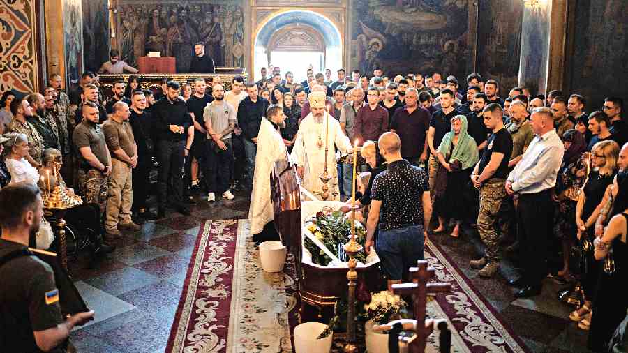Family and friends at a memorial service for Ukrainian serviceman Ivan Chekaniuk, who died during a combat mission in Sievierodonetsk, at  St Michael’s Golden-Domed Cathedral, Kyiv.