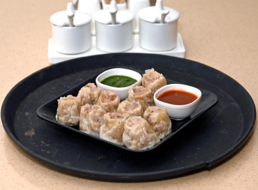 A plate of Sui Mai to satisfy your snacky cravings! Filled with chicken and black mushroom, this delectable dish costs Rs 250 