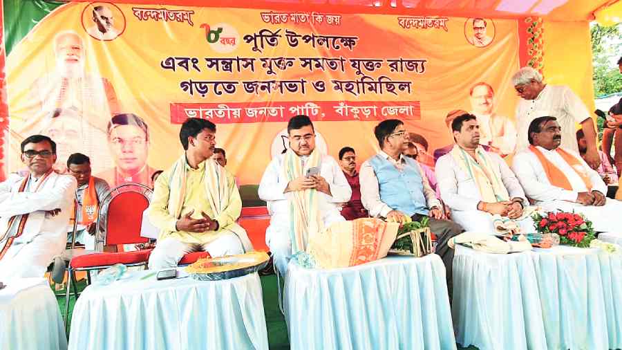 Suvendu Adhikari and other BJP leaders at the programme in Bankura on Tuesday to celebrate the  Modi government’s eight years