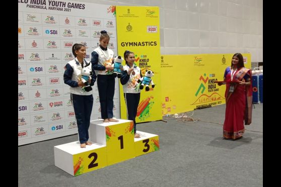 Anushka Jana receiving the gold medal for floor exercise at Khelo India Youth Games 2021 in Haryana. 