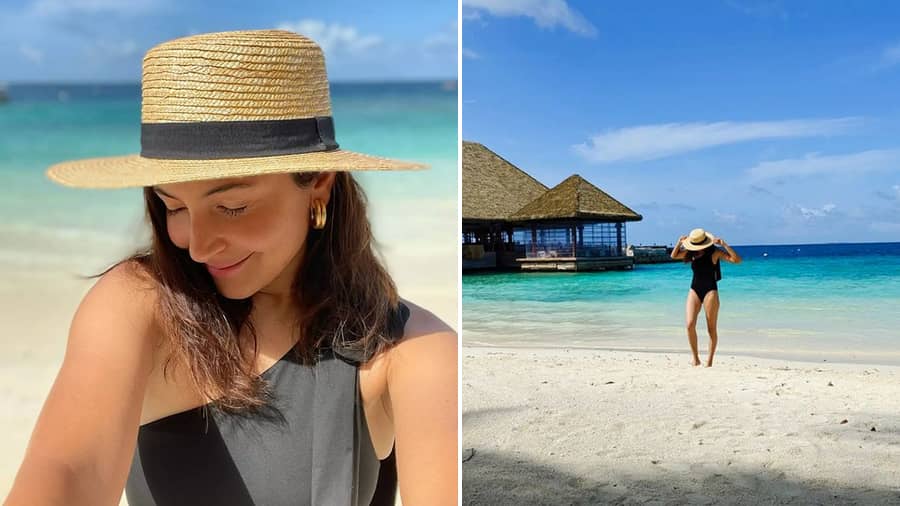 Anushka Sharma: The classic black monokini is a wardrobe must. The actress ticks all the right boxes with her sun hat and gold hoop earrings. #timeslessblack