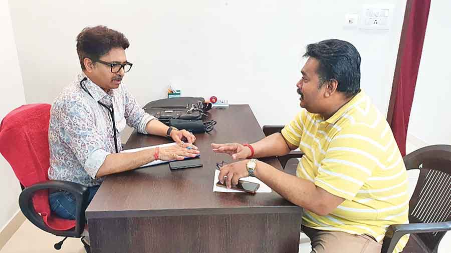 Dr Pratik Dasgupta, one of the resident doctors, checks on a patient at the medical centre on Wednesday evening