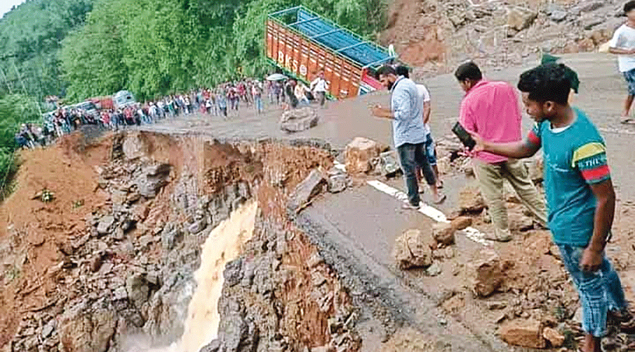 A caved stretch of the NH 6 under Lumshnong PS in the East Jaintia Hills district of Meghalaya on Thursday.
