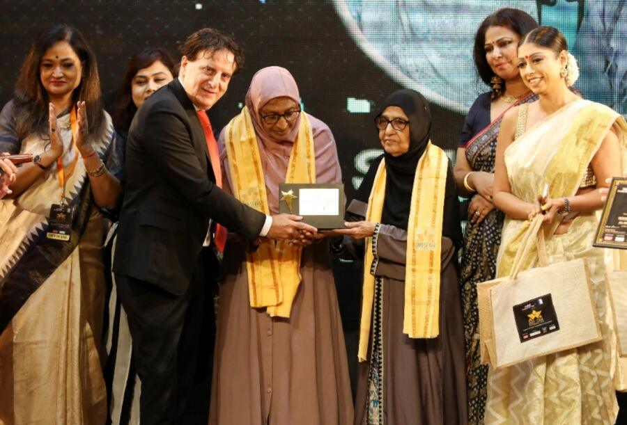 French consul-general Didier Talpain presents the Lifetime Achievement Award to All Bengal Muslim Women’s Association president Noor Jahan Shakil and secretary Saboohi Aziz in recognition of their valuable work in the field of women empowerment.