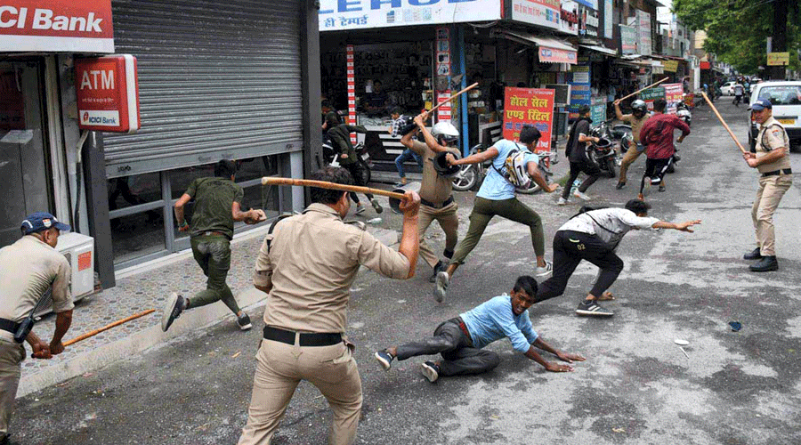 Police lathi-charge protesters in Haldwani on Friday.