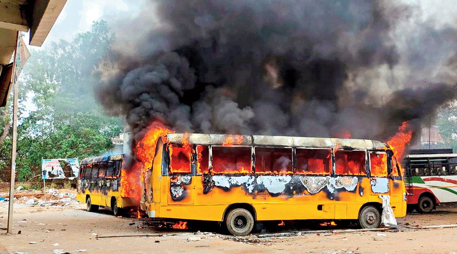 Buses torched by protesters in Aurangabad on Friday.