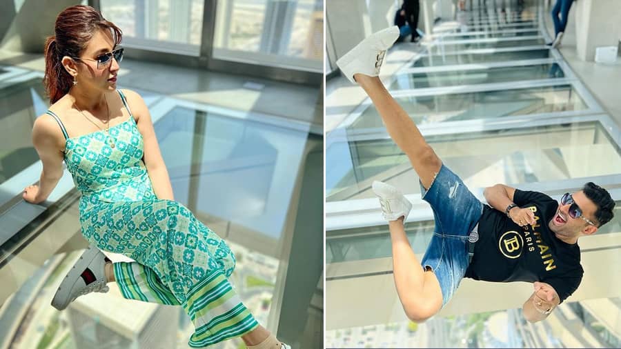 One from the Sky Views Observatory and its stellar glass floor! Ankush’s ripped jeans shorts and Oindrila’s noodle strap dress paired with comfy sneakers is #VacayOOTD duly bookmarked.