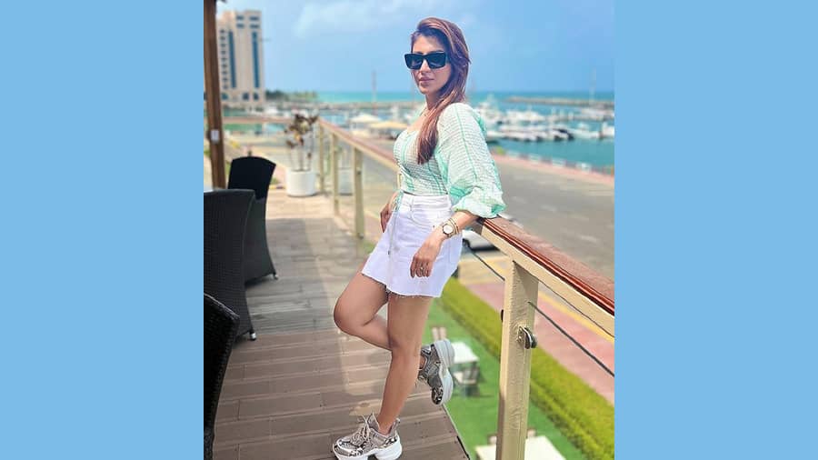 White shorts are a summer wardrobe staple. Pair it with a cotton striped top like Oindrila, and you are ready to ace the fashion race. The cool sneakers are a true steal deal!