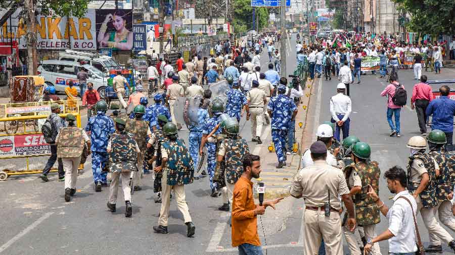 Security personnel patrol during the Bihar Bandh, called to protest against Agnipath scheme in Patna